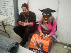 "Tired Wolf (it's Caroline!) kicks back at end of Climate March with long-time poet-ally Nick Adamski, the pollinating agent for Poetry Brothels…" photo by McCarty Baker